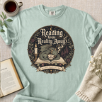 "Reading Keeps Reality Away" Cozy Tee